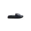 A black slide sandal with a logo on the strap, shown from the side on a white background. Podgląd zdjęcia produktu
