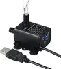 A black USB DC water pump with water flowing out of the nozzle, shown on a white background. Podgląd zdjęcia produktu