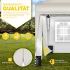 A diagram illustrating the features of a beige pop-up gazebo, set against a grassy outdoor background. Náhľad obrázku produktu