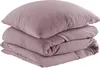 A stack of folded mauve-colored muslin bedding, including a pillow and a duvet cover, is shown against a white background. Produktbild-Vorschau