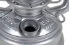 A close-up view of the top of a silver metal lantern, showing the fuel cap opening and embossed text. Produktbild-Vorschau