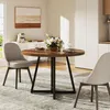 A round dining table with two chairs in a dining room setting. Podgląd zdjęcia produktu