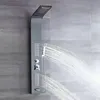A modern shower panel with multiple spray functions is shown against a tiled wall. Podgląd zdjęcia produktu