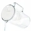 A clear plastic pitcher with a white lid, pouring water. Produktbild-Vorschau