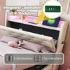 A bed with a headboard featuring integrated lighting and charging ports, with decorative items on the shelf. Voir les images du produit