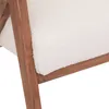 A close-up view of the corner of a white armchair with a wooden frame. Podgląd zdjęcia produktu