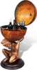 A globe bar supported by a statue of Atlas, holding wine bottles and a glass. Náhľad obrázku produktu