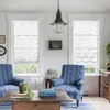 A living room scene with two chairs, a coffee table, and windows with blinds. Produktbild-Vorschau