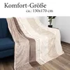 A blanket draped over a blue sofa, with a plant in the background. Produktbild-Vorschau