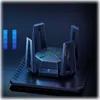 A futuristic-looking black router with green accents, set against a dark background. Two vertical blue bars with icons are visible on the left side. Podgląd zdjęcia produktu