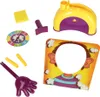 A collection of game pieces for the Pie Face game, including a spinner, a throwing arm with a hand, a face cutout board, and the main game mechanism. Podgląd zdjęcia produktu