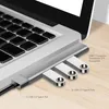 A USB hub is connected to a laptop, with USB drives plugged into the hub. Produktbild-Vorschau
