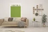 A living room scene with a sofa, a coffee table, and wall decorations. Produktbild-Vorschau