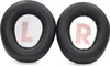 Two black ear pads for headphones, each with a white insert showing a letter and red stripes. Produktbild-Vorschau