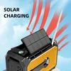 A close-up of a portable emergency radio with a solar panel tilted upwards, against a bright blue sky with stylized red arrows indicating solar charging. Náhled obrázku produktu