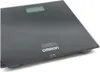 A black digital bathroom scale with a display screen and the brand logo visible. Podgląd zdjęcia produktu