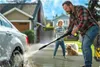 A father and son are washing a car in the driveway with a pressure washer, with their dog watching. Náhľad obrázku produktu