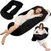 A collage of images showing a black U-shaped pregnancy pillow in different uses. Produktbild-Vorschau