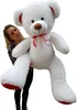 A woman is holding a large white teddy bear. Náhľad obrázku produktu
