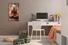 A child's room with a desk, chair, and wall art. Produktbild-Vorschau