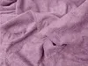 A close-up view of a crumpled pink terry cloth fabric. Podgląd zdjęcia produktu
