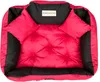 A red and black dog bed with two small pillows. Voir les images du produit