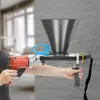 A person is holding a mortar gun and applying sealant into a crack in a wall. Podgląd zdjęcia produktu
