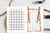 A collage showing a schematic of a climbing net and a wooden climbing frame with a net attached, with rope elements in the background. Produktbild-Vorschau