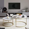 A living room scene with a TV, entertainment center, and two round coffee tables. Voir les images du produit