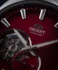 A close-up view of a red watch face with silver hands and markers. Podgląd zdjęcia produktu