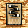 A wine rack mounted on a brick wall, displaying wine bottles and wine glasses. Produktbild-Vorschau