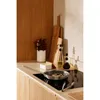 A kitchen counter with cooking utensils and ingredients. Náhľad obrázku produktu