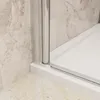 A close-up view of a shower enclosure corner, showing the base and the glass door frame. Produktbild-Vorschau