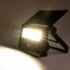 A black solar-powered floodlight with a bright white light is shown on a neutral background. Produktbild-Vorschau