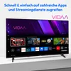 A modern flat-screen television displaying a smart TV interface with various app icons and recommended content. Produktbild-Vorschau
