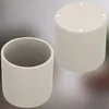 Two beige cylindrical pots, one open and one closed, are shown against a neutral background. Podgląd zdjęcia produktu