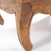 A close-up view of the carved wooden leg of a table. Náhľad obrázku produktu