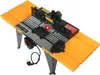 A router table with orange extension wings and a black and gray main body, shown from a slightly elevated angle. Anteprima dell’immagine prodotto