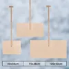Three wooden snow shovels of different sizes are displayed against a blurred background. Náhled obrázku produktu