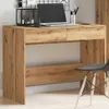 A wooden desk with a laptop and office supplies. Anteprima dell’immagine prodotto