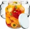 A group of glass jars, one filled with colorful mini peppers in brine, and a white lid. Anteprima dell’immagine prodotto