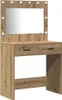 A makeup vanity table with a mirror and lights. Voir les images du produit
