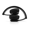 A pair of black headphones folded and resting on a white surface. Náhled obrázku produktu