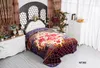 A bedroom scene with a bed dressed with a patterned blanket. Produktbild-Vorschau