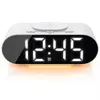 A white digital alarm clock with a digital display showing the time 12:45 and an orange LED light strip at the bottom. Anteprima dell’immagine prodotto