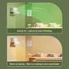 The image shows two scenarios of an air conditioner deflector being used in a living room. The top panel shows cool air being distributed, and the bottom panel shows warm air sinking. Podgląd zdjęcia produktu