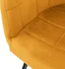 A close-up view of a mustard yellow upholstered chair, showing the quilted texture and stitching. Náhľad obrázku produktu