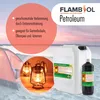 A marketing image for FLAMBOSOL Petroleum, showing a large and small container of the product, along with a tent and lanterns on a beach at sunset. Produktbild-Vorschau