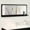 A bathroom mirror with a shelf above a sink. Voir les images du produit