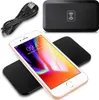 A wireless charger and a smartphone are displayed on a white background. Produktbild-Vorschau